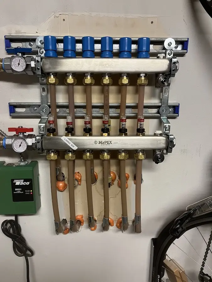 Plumber performing Leak Detection at a residential property in Branford